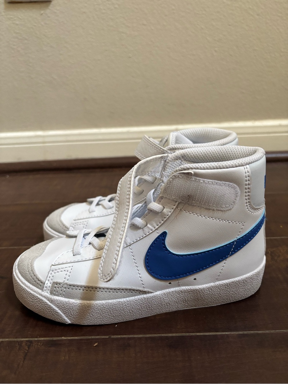 Nike Kids White High-Top Sneakers with Blue Swoosh